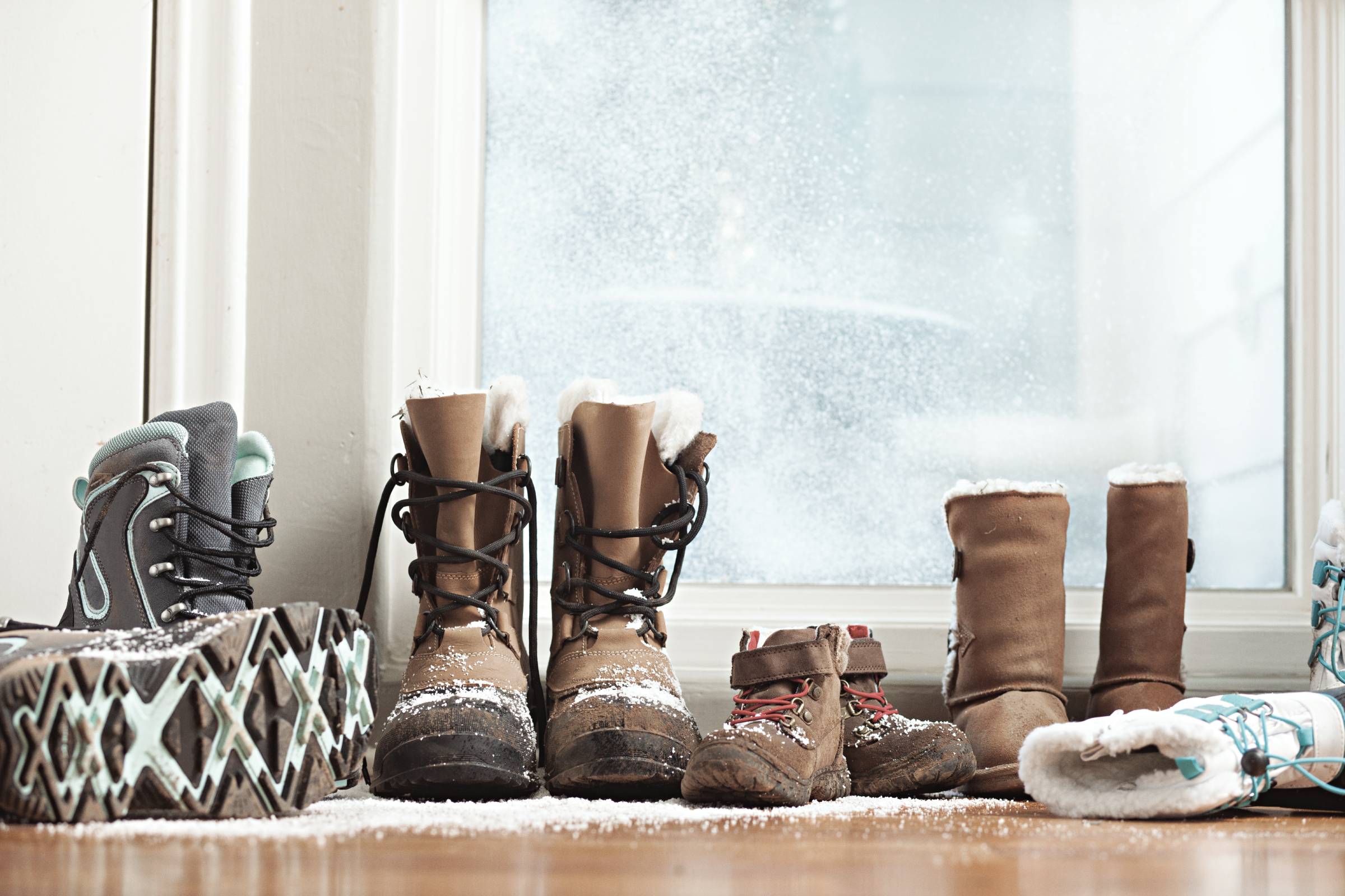 Snow boots lined up by the front door.