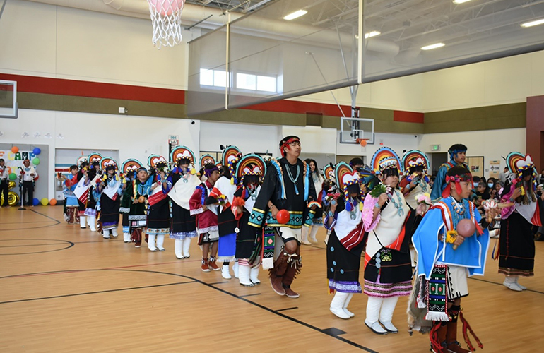 Native American children perform cultural dances